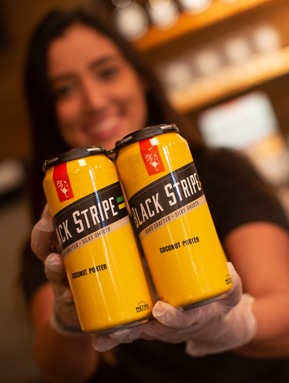 Closeup of two Black Stripe cans
